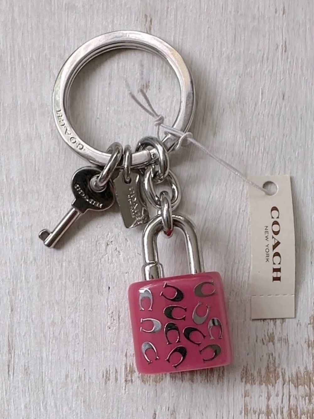 COACH LOCK AND KEY KEY RING  PURSE CHARM PINK AND SILVER NEW NWT (RETIRED) W/BOX